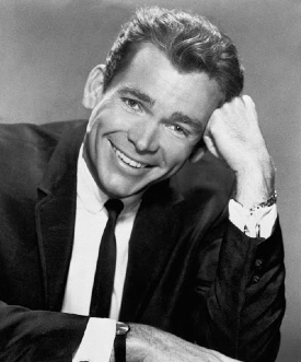 dean jones sorride e si tiene la testa col pugno - nerdface