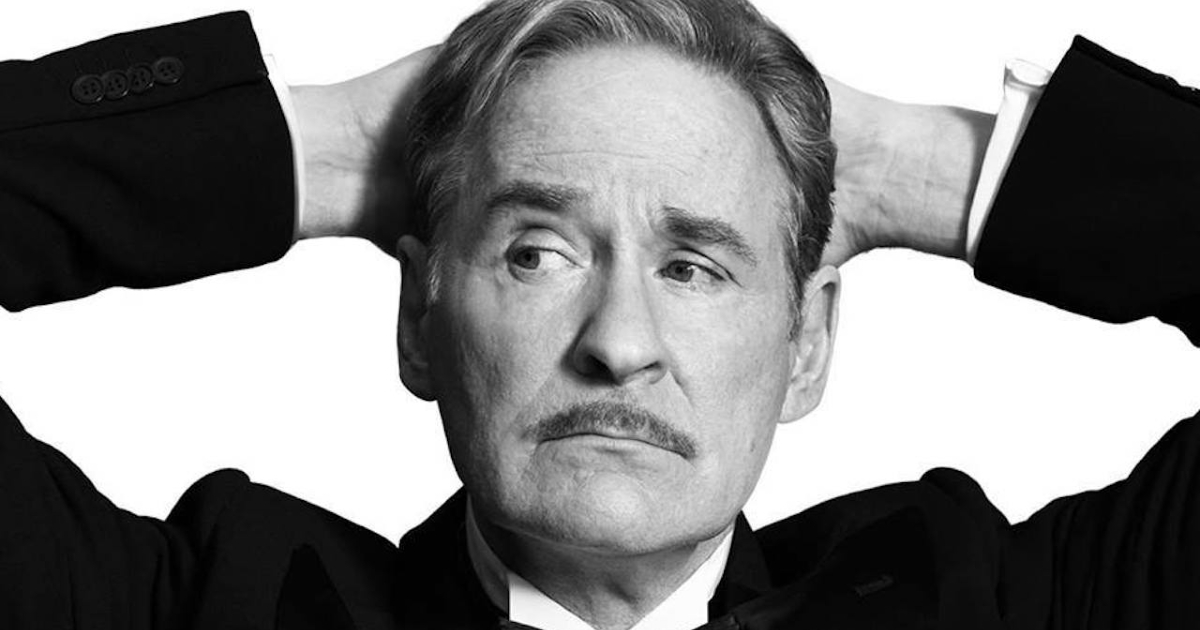 kevin kline col baffo si tiene la testa con le mani - nerdface