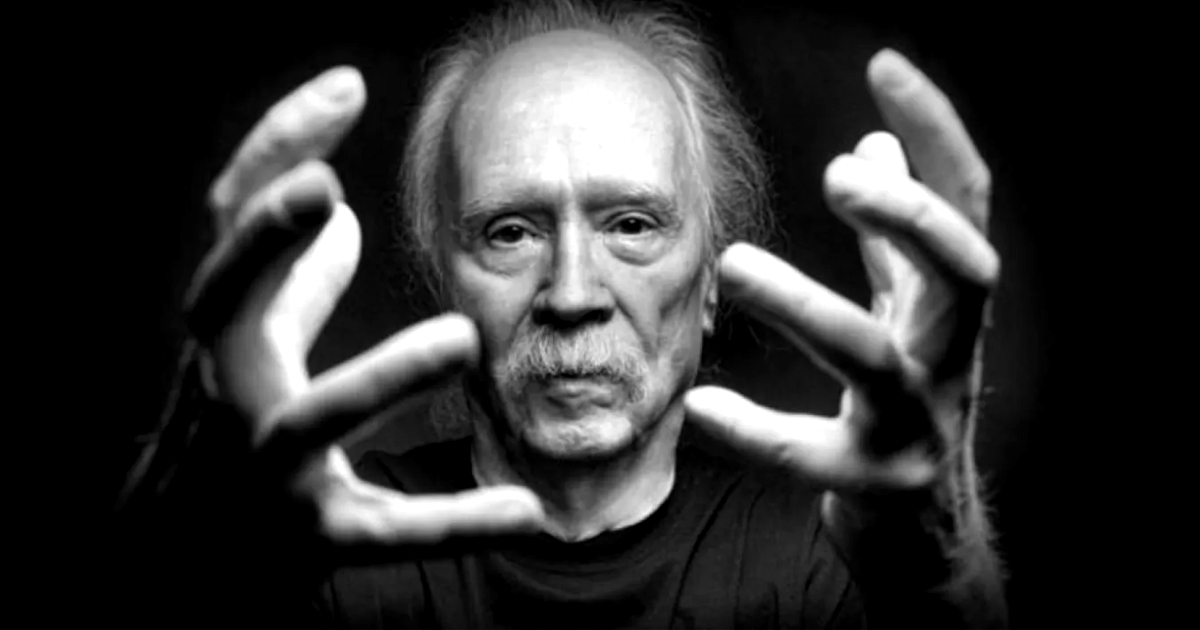 john carpenter tiene le mani di fronte al volto con i palmi rivolti a sé - nerdface