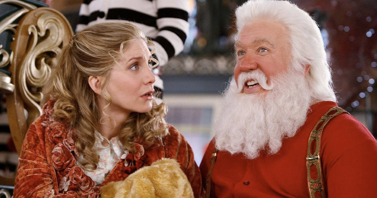 santa clause al fianco di una donna - nerdface