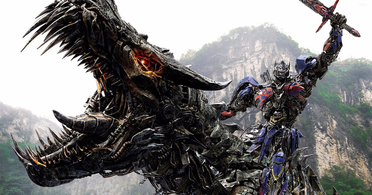 optimus prime cavalca un dinosauro robot impugnando una spada - nerdface