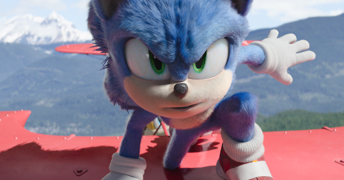 sonic è seduto sull'ala di un biplano rosso, pronto a scattare - nerdface