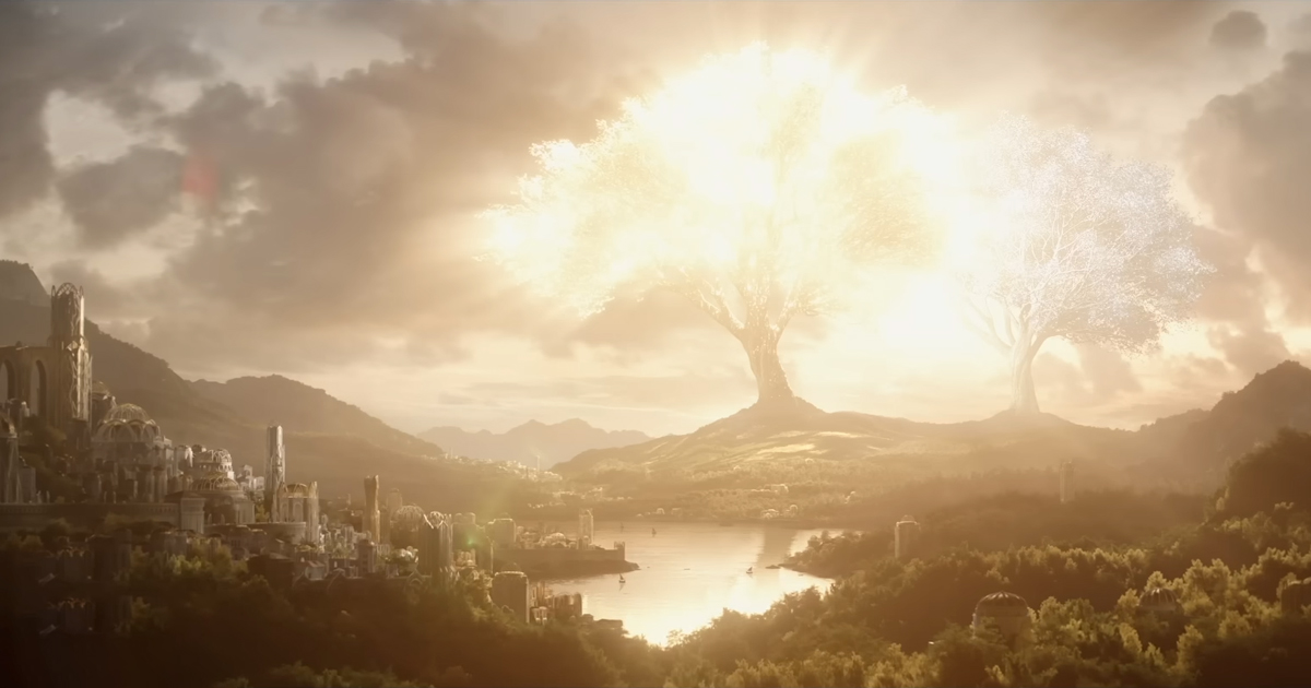un albero luminoso si erige di fronte a una città nel secondo teaser de gli anelli del potere - nerdface