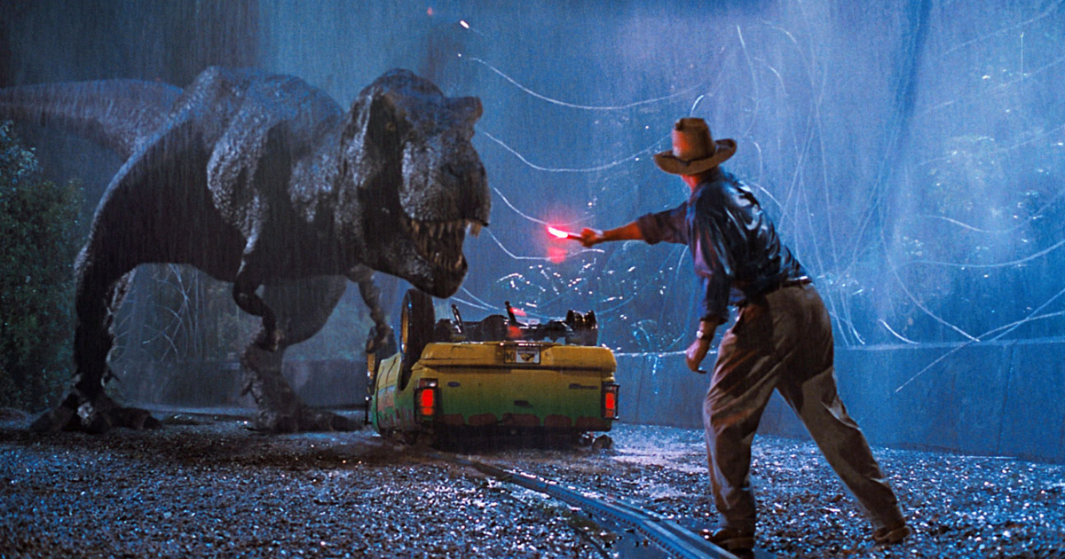 un uomo attira l'attenzione di un t-rex in jurassic park - nerdface