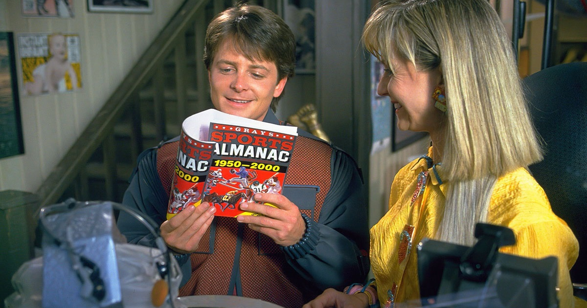 marty sfoglia il grande almanacco sportivo in ritorno al futuro 2 - nerdface